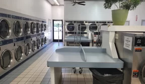 Apartment building coin operated laundry center.